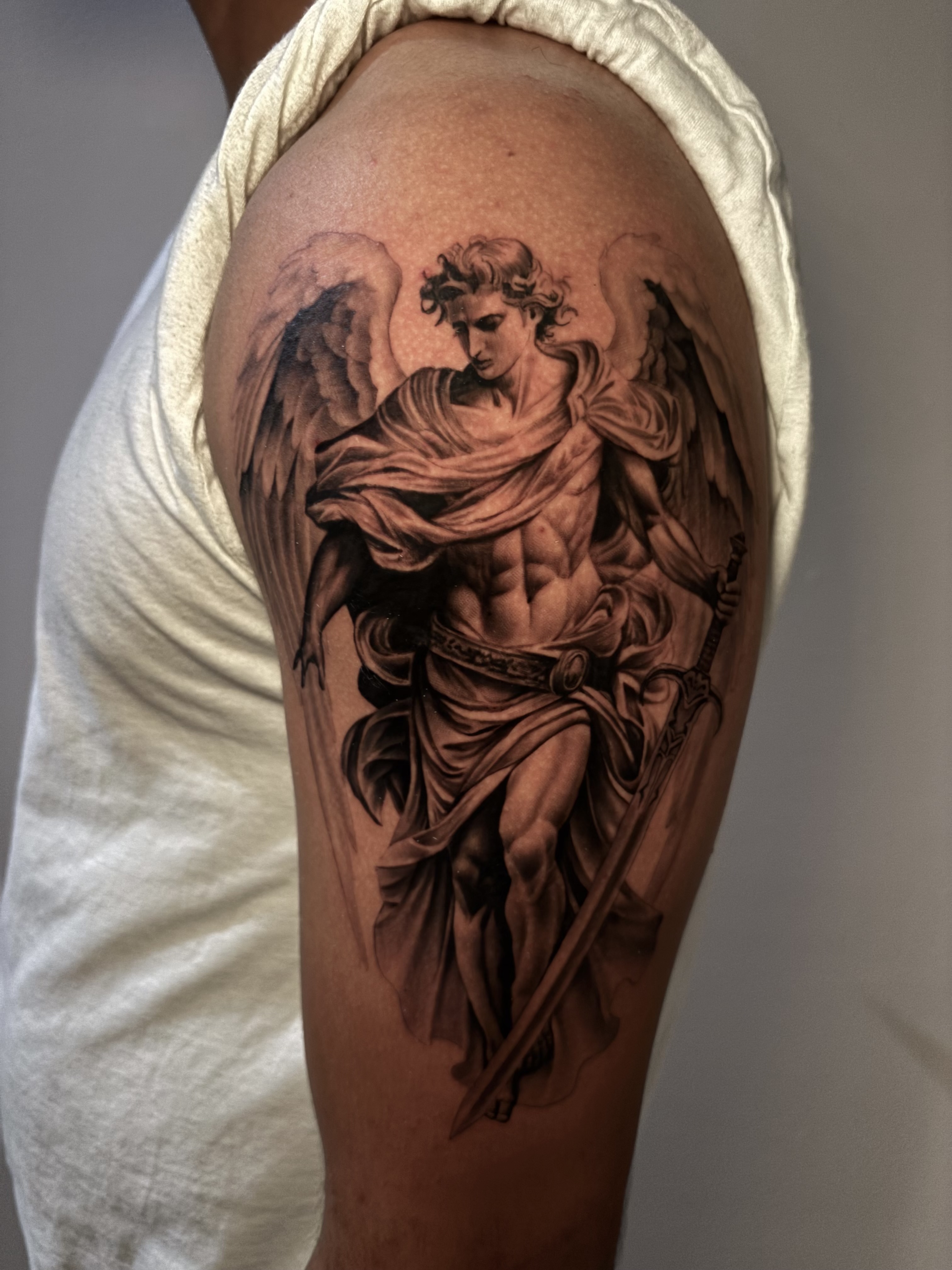 Black and grey classical angel statue tattoo